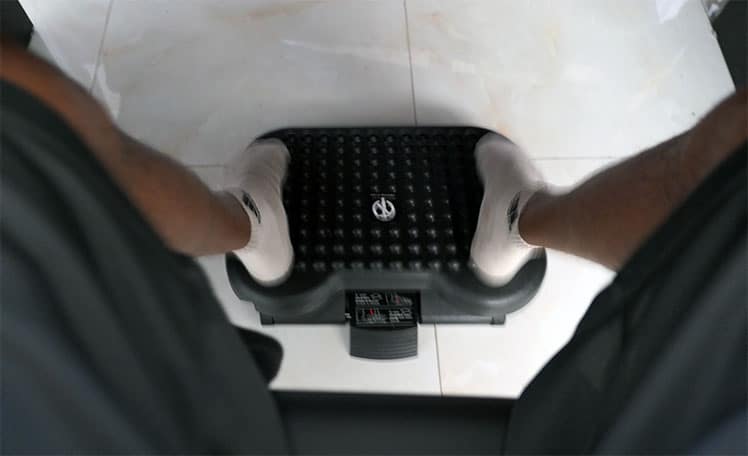 Using a footrest to add movement while sitting