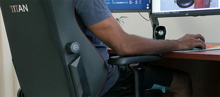 How are gaming chair armrests good for the back?
