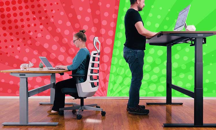 Woman sitting at a desk vs man standing at a taller desk
