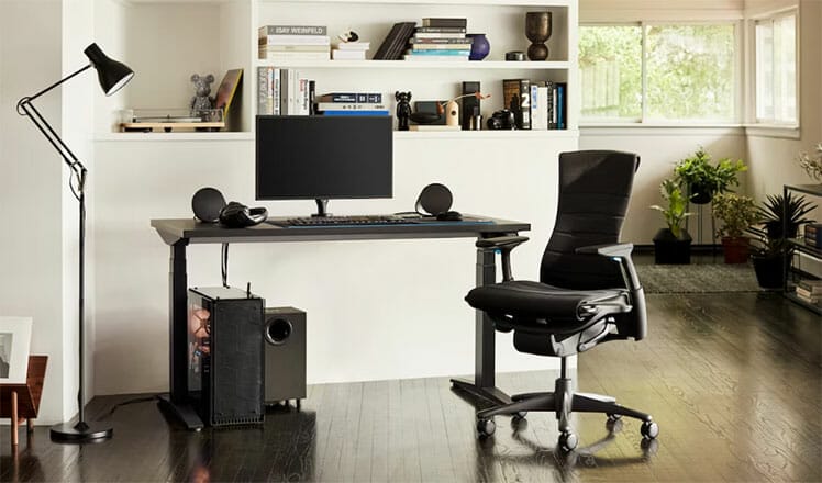 Herman Miller gaming desk and chair setup in living room