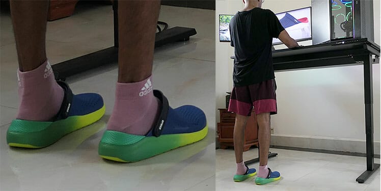 Standing desk user wearing Crocs Lightride shoes for anti-fatigue support