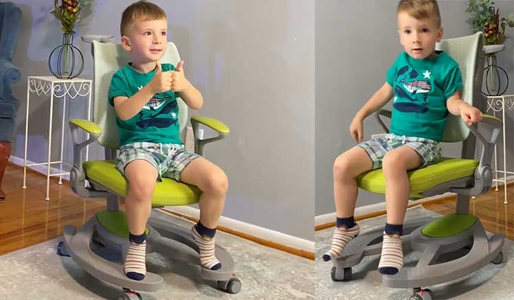 Child sitting in ApexDesk mesh desk chair for kids