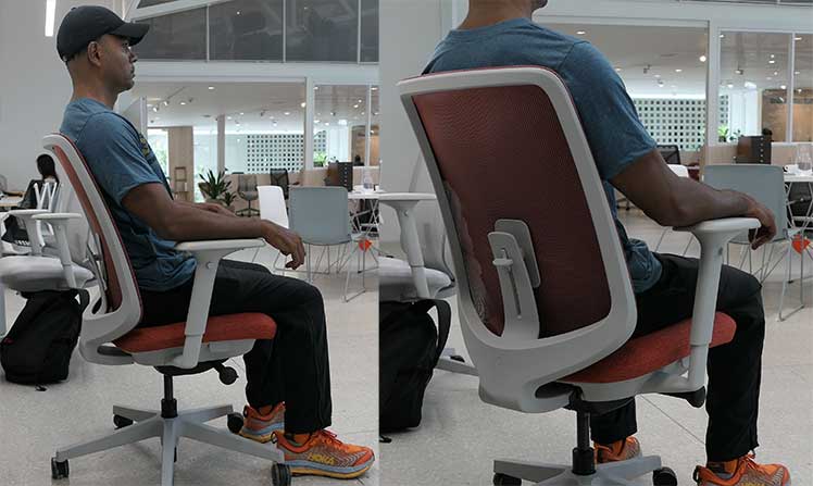 Man sitting in a Herman Miller Verus chair: side and rear views