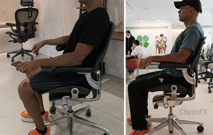 Side view of man sitting in 2 Herman Miller Aeron chairs equipped with Posturefit Lumbar support