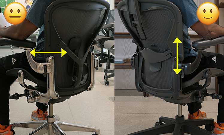 Man sitting in Aeron chairs to test Posturefit vs sliding lumbar pad support types