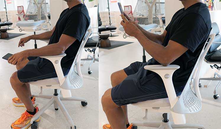 Man sitting in a Herman Miller Sayle chair