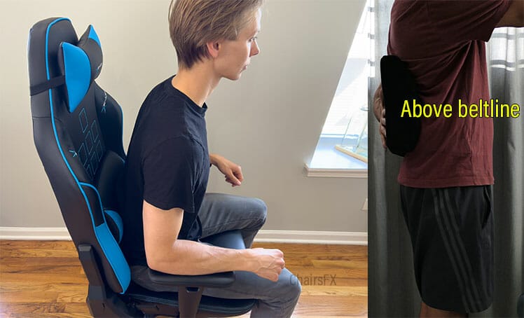 Side view of a person seated upright in a budget gaming chair with a removable lumbar pillow positioned above the beltline to support a neutral spine.
