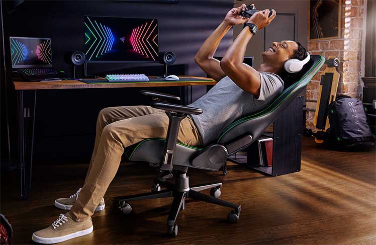 Hardcore Razer gaming fan mobile computing in a Razer Enki gaming chair